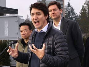 Prime Minister Justin Trudeau makes a housing announcement with B.C. Premier David Eby and Vancouver Mayor Ken Sim at the University of British Columbia in Vancouver on Tuesday, Feb. 20, 2024.