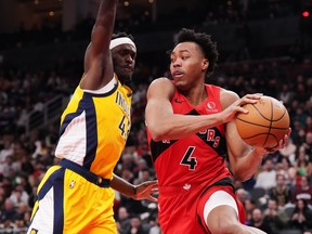Toronto Raptors forward Scottie Barnes (4) drives past Indiana Pacers forward Pascal Siakam in a game before the all-star break.