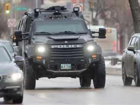 Police armoured assault vehicle in traffic