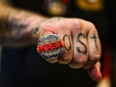 A supporter of former US President and 2024 presidential hopeful Donald Trump wears a MAGA ring as he attends a Super Tuesday election night watch party at Mar-a-Lago Club in Palm Beach, Florida, on March 5, 2024.