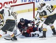 Winnipeg Jets' Tyler Toffoli (73) gets hit by a shot in front of Vegas Golden Knights goaltender Logan Thompson (36) during first period NHL action in Winnipeg on Thursday.