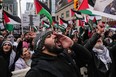 A pro-Palestine march gathers in a Toronto intersection on Sunday Oct. 29, 2023.