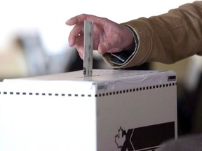 A voter casts a ballot in the 2011 federal election.