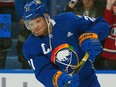 Kyle Okposo of the Buffalo Sabres warms up wearing an NHL Pride jersey before the game against the Montreal Canadiens at KeyBank Center on March 27, 2023 in Buffalo, New York.