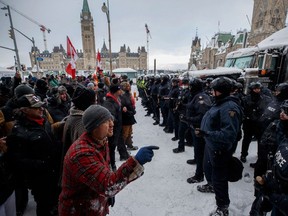 Police move in to clear downtown Ottawa near Parliament hill of protesters after weeks of demonstrations on Feb. 19, 2022.