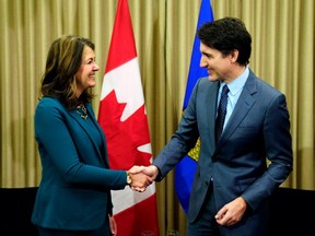 Prime Minister Justin Trudeau meets with federal carbon tax critic Alberta Premier Danielle Smith in Calgary on Wednesday, March 13, 2024.