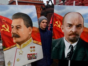 Russian Communist party supporters gather to lay flowers to the tomb of late Soviet leader Joseph Stalin to mark the 144th anniversary of his birth at Red Square in Moscow on December 21, 2023.