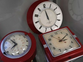 A selection of vintage clocks are displayed at the Electric Time Company, March 9, 2023, in Medfield, Mass.