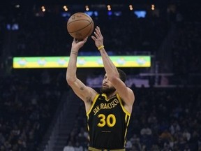 Golden State Warriors guard Stephen Curry shoots a 3-point basket during the first half of an NBA basketball game against the Memphis Grizzlies, Wednesday, March 20, 2024, in San Francisco.