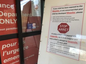 A sign at the Children's Hospital of Eastern Ontario (CHEO) emergency entrance gave instructions to parents if their child had been exposed or has developed measles back in April, 2019.