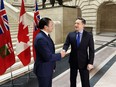 Conservative Leader Pierre Poilievre, right, shakes hands with Manitoba Premier Wab Kinew prior to a meeting at the legislature in Winnipeg on Thursday, March 28, 2024.