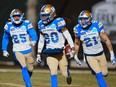 Winnipeg Blue Bombers wide receiver Janarion Grant (80) celebrates with teammates Tyrell Ford (25) and Winnipeg Blue Bombers defensive back Nick Hallett (21) after running back a punt for a touchdown against the Toronto Argonauts during second half action at the 109th Grey Cup at Mosaic Stadium in Regina, Sunday, Nov. 20, 2022. Ford can see coaching in his football future but he's very content to be hanging up his whistle for the next little while. The 25-year-old defensive back will resume his CFL career with the Winnipeg Blue Bombers in 2024 after missing last season awaiting a second NFL opportunity.