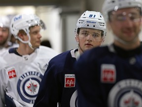Winnipeg Jets forward Cole Perfetti walks with teammates to the practice rink this week.