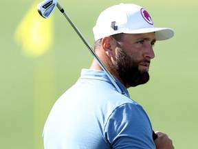 Jon Rahm looks on in the practice area prior to the 2024 Masters Tournament.