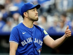 Yusei Kikuchi of the Toronto Blue Jays gestures as he walks back to the dugout after pitching in the second inning against the Kansas City Royals at Kauffman Stadium on April 22, 2024 in Kansas City, Missouri.