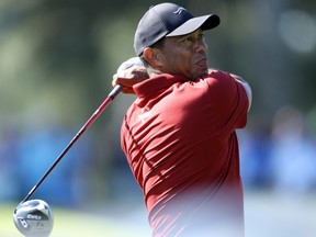 Tiger Woods plays his shot from the third tee during the final round of the 2024 Masters Tournament.