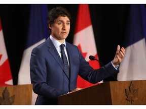 Canadian Prime Minister Justin Trudeau speaks during a joint press conference with French Prime Minister Gabriel Attal (out of frame) at the Sir John A. Macdonald building in Ottawa on April 11, 2024. (Photo by PATRICK DOYLE / AFP)
