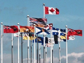Provincial flags surround the Canadian flag in a file photo from Vancouver's Canada Place. The next federal administration needs to officially recognize the regional character of Canada in a new and constructive way, writes Preston Manning.