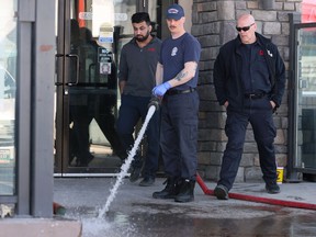 Firefighters clean up after a stabbing