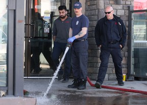 Firefighters clean up after a stabbing