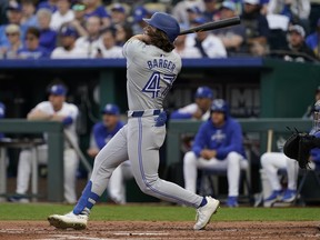 Addison Barger #47 of the Toronto Blue Jays hits a fly out against the Kansas City Royals in the third inning at Kauffman Stadium on Wednesday. /Getty Images)