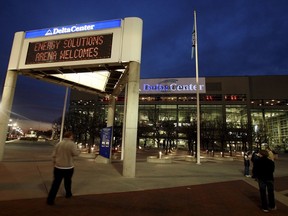 FILE - The marquee in front of the Energy Solutions Arena, formerly the Delta Center, home of the Utah Jazz, shows conflicting signage at dusk before a game against the Toronto Raptors, Monday, Nov. 20, 2006, in Salt Lake City. Preparations are being made in case an NHL team is in Salt Lake City sooner than later. Prospective owner Ryan Smith earlier this week solicited public suggestions for a team name. All this comes as the Arizona Coyotes are hoping to win a land auction for a site to build a new arena in the city of Phoenix.