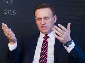 Russian opposition politician Alexei Navalny gestures while speaking during his interview to the Associated Press in Moscow, Russia on Dec. 18, 2017.