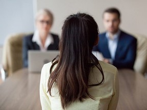 Businesswoman and businessman HR manager interviewing woman