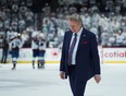 Head coach Rick Bowness of the Winnipeg Jets walks on the ice after his team lost the game and the series to the Colorado Avalanche