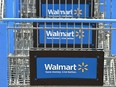 Shopping carts with the Walmart logo outside a Walmart store in Burbank, California on August 15, 2022.