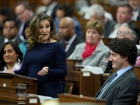 Finance Minister Chrystia Freeland, left, makes a speech in the House of Commons in Ottawa on April 16, as Prime Minister Justin Trudeau looks on.