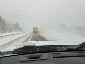A snow plow on the highway