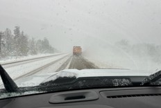 A snow plow on the highway