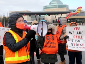PSAC members rally at the entrance of National Defence Headquarters in Ottawa on March 21.