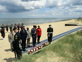 Prime Minister Justin Trudeau will travel to France next month for the 80th anniversary of D-Day. Trudeau and the Prime Minister of France Edouard Philippe take part in a wreath laying as part of the D-Day 75th Anniversary Canadian National Commemorative Ceremony at Juno Beach in Courseulles-sur-Mer, France, Thursday, June 6, 2019.