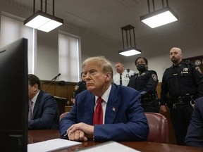 Former president Donald Trump sits in Manhattan Criminal Court in New York on April 30. MUST CREDIT: Victor J. Blue for The Washington Post
