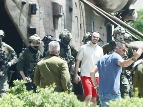 Israeli hostage Andrei Kozlov, 27, exits a helicopter that landed in the grounds of the Sheba Medical Center, after his rescue by the Israeli army from captivity in the Gaza Strip, in Ramat Gan, Israel, on June 8.