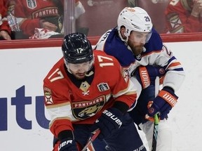 Evan Rodrigues #17 of the Florida Panthers and Leon Draisaitl #29 of the Edmonton Oilers compete for the puck during the second period in Game Two of the 2024 Stanley Cup Final at Amerant Bank Arena on June 10, 2024 in Sunrise, Florida. (Photo by Elsa/Getty Images)