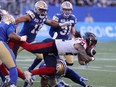 Alouettes RB Sean Thomas Erlington leaps with the ball during Montreal’s 27-12 win over the Bombers on Thursday.