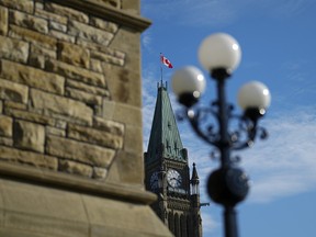 Canada flag flies atop of the Peace Tower on Parliament Hill in Ottawa on Wednesday, June 19, 2024.