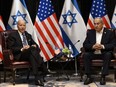 U.S. President Joe Biden (L) listens to Israel's Prime Minister Benjamin Netanyahu