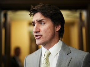 Prime Minister Justin Trudeau speaks to reporters in the foyer of the House of Commons on Parliament Hill in Ottawa on Tuesday, May 28, 2024.