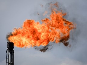 A flare stack burns off excess gas at a processing facility near Crossfield, Alta., Tuesday, June 13, 2023.