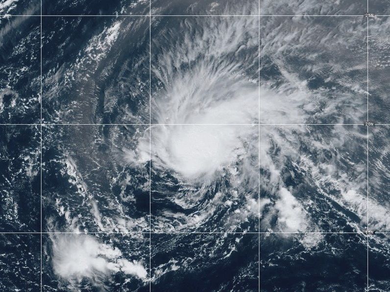 Isaac strengthens into a hurricane in the Atlantic Ocean and Tropical