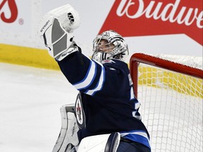 Winnipeg Jets goaltender Connor Hellebuyck makes a save