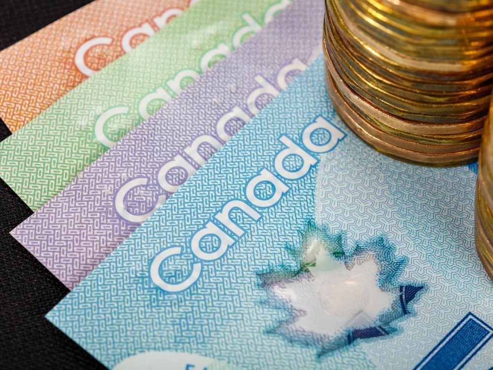 Canadian money spread out on a table