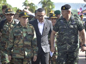 FILE - In this photo released by the Thai Royal Thai Army, Cambodian Chief of Army Mao Sophan, left, meets with Thailand Chief of Army Gen. Pana Claewplodtook, right, at a border checkpoint in Surin province, Thailand, May 29, 2025. (Thai Royal Thai Army via AP, file)