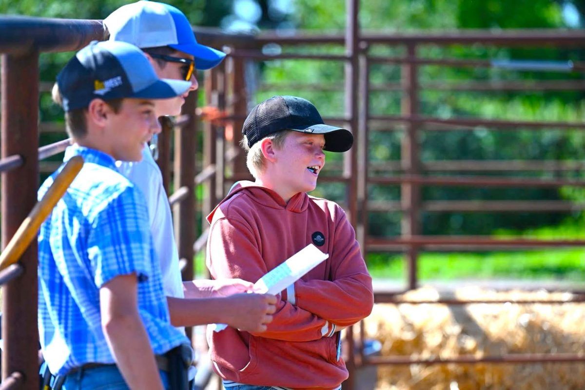 Brayden Steppler with friends Nathan Armstrong and Hayden Collins, taking in the Manitoba Simmental Pen Show this summer.
